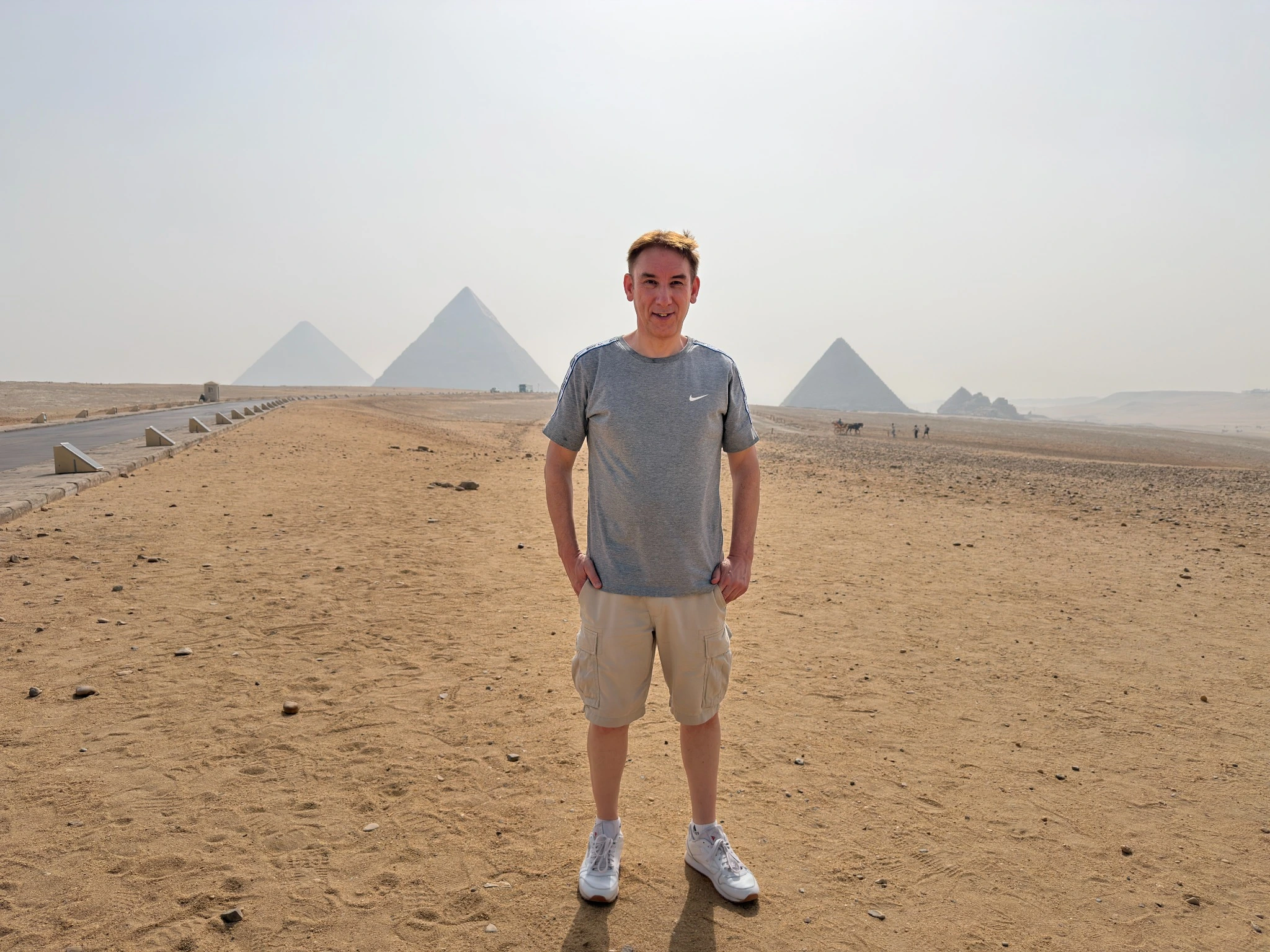 Paul standing in front of the pyramids in Egypt